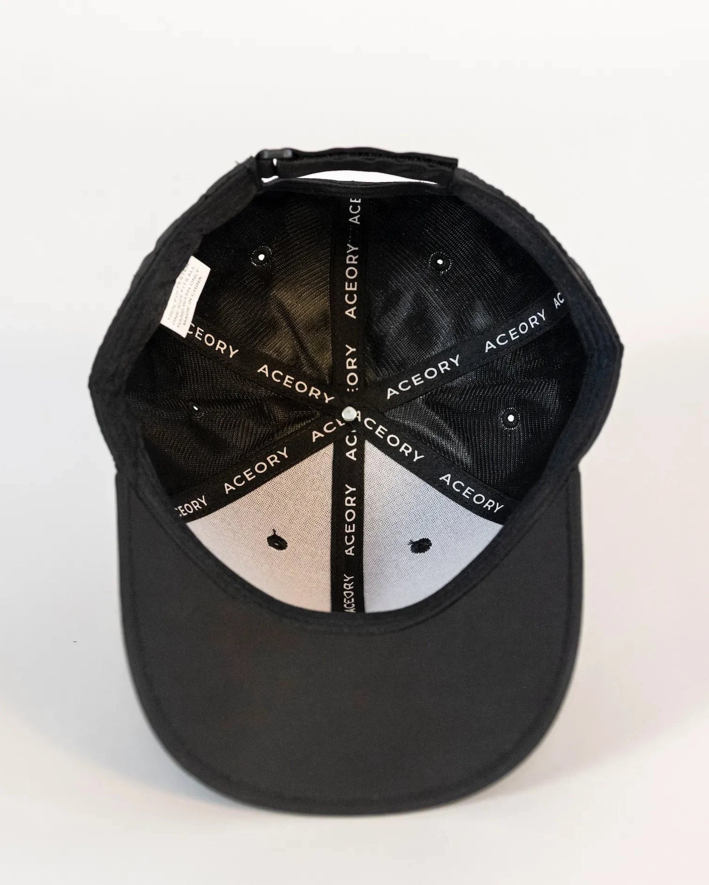 Inside view of the Aceory golf cap showing branded taping and construction.