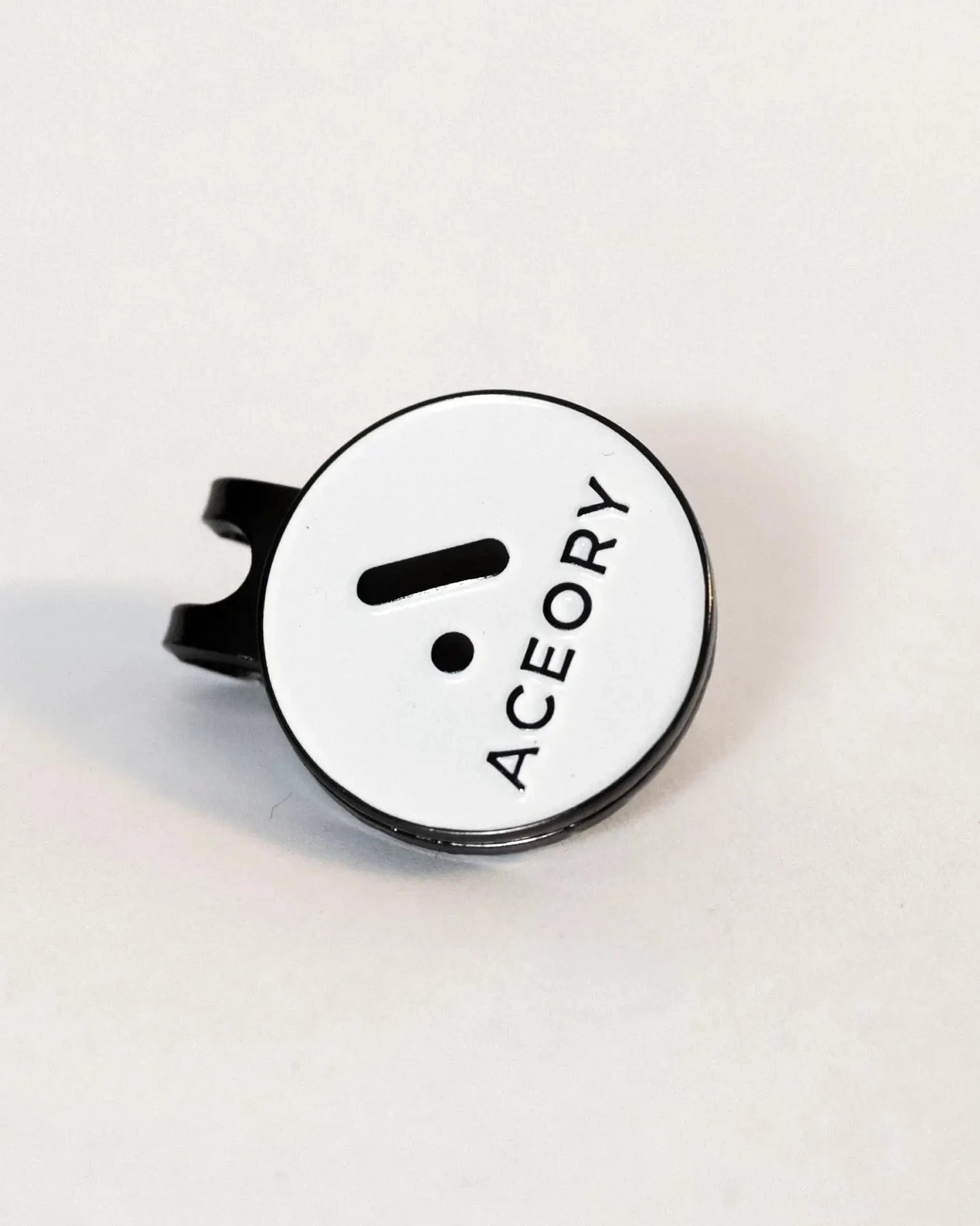 Angled view of the Aceory magnetic ball marker highlighting the clean white finish.