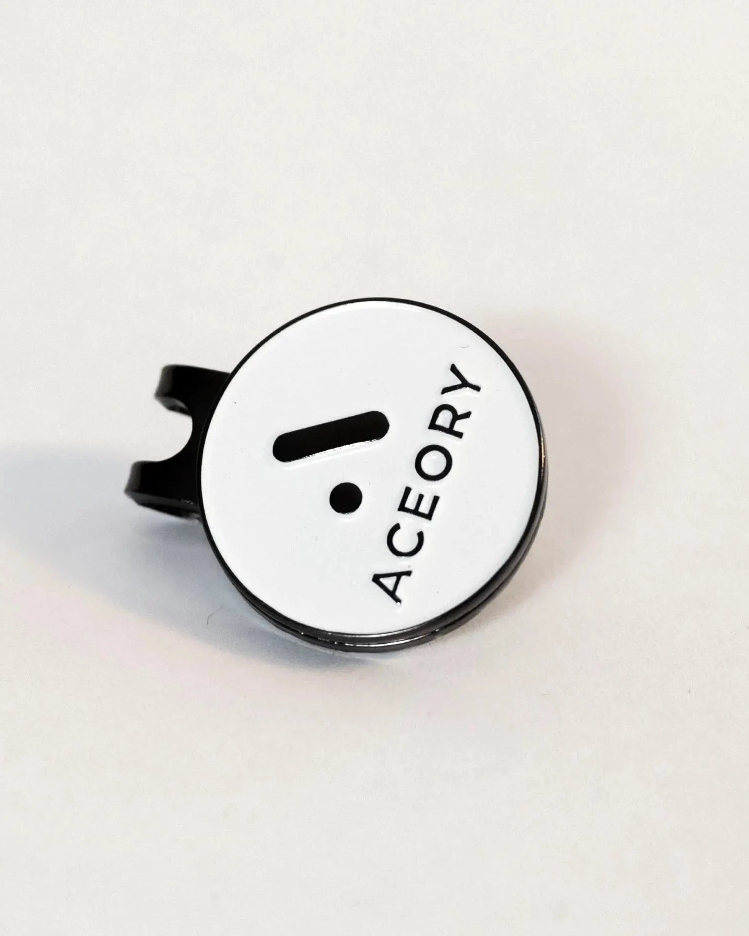 Angled view of the Aceory magnetic ball marker highlighting the clean white finish.